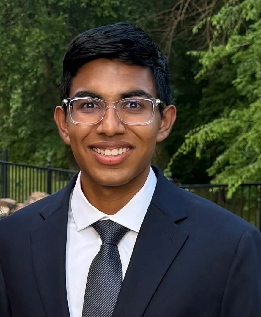 Dhruva Kumar wearing a suit and tie